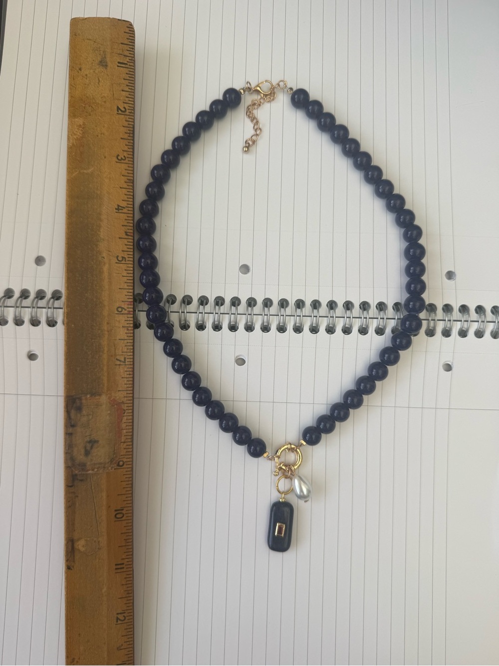 Elegant Navy Blue Beaded Necklace with Gold Accents and charms